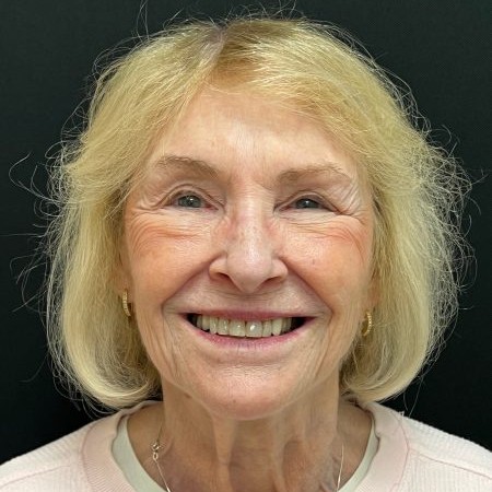 a woman smiling at the camera