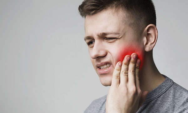 a man has Toothache